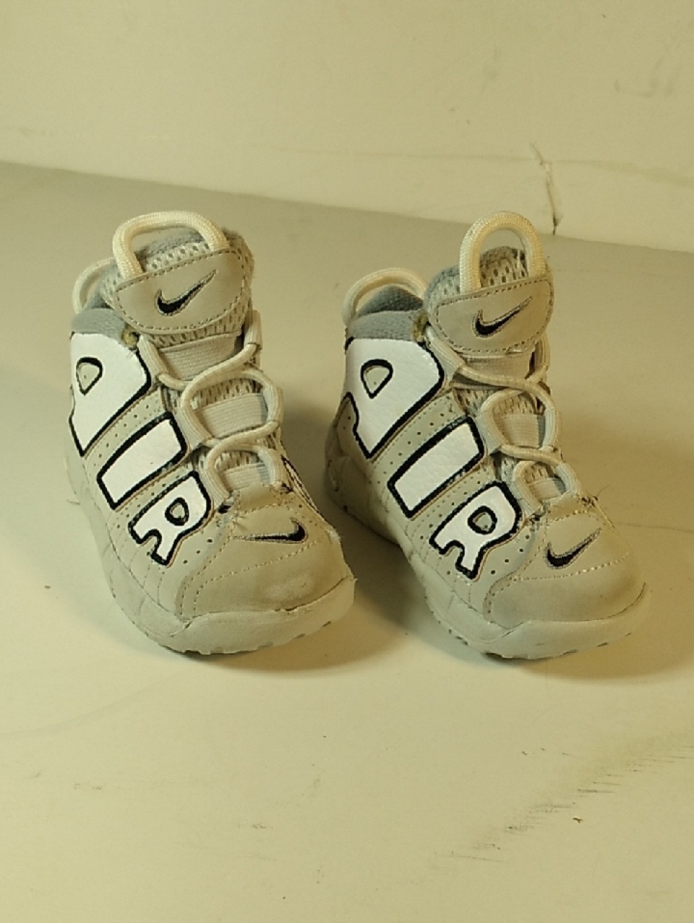 Nike Kids White and Tan High-Top Sneakers with Bold AIR Detail
